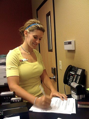 bank teller cleavage showing