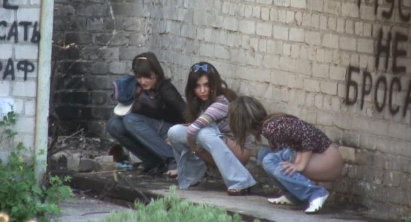 the girls sitting on toilet pooping